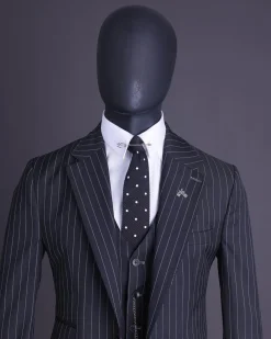 A charcoal black and ivory pencil stripe, notch lapel, knitted one button suit