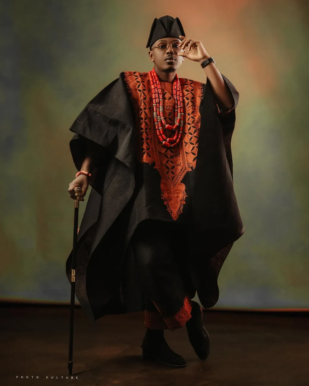 A Charcoal black, Arewa embroidery, front cut towards the back, traditional Agbada