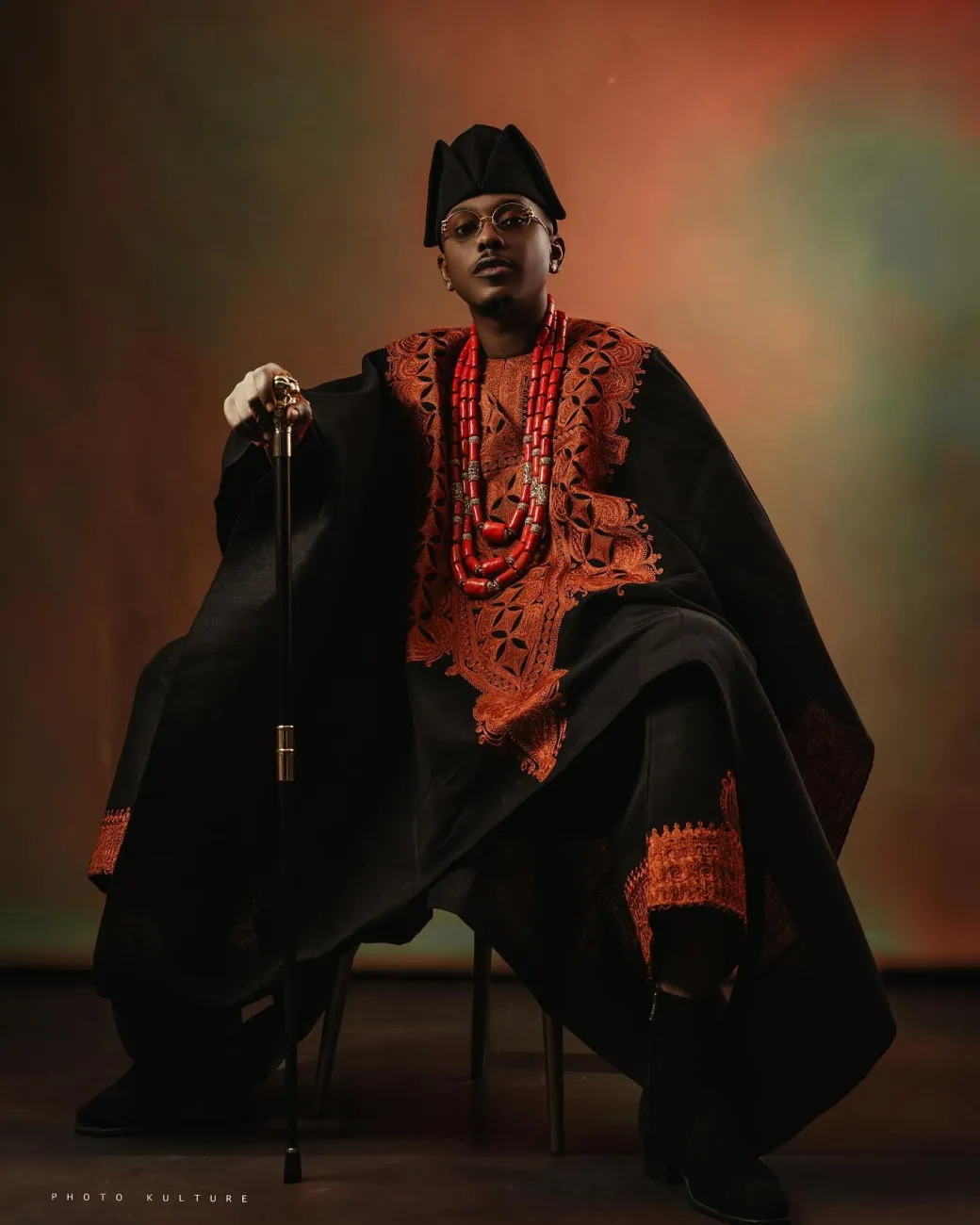 A Charcoal black, Arewa embroidery, front cut towards the back, traditional Agbada