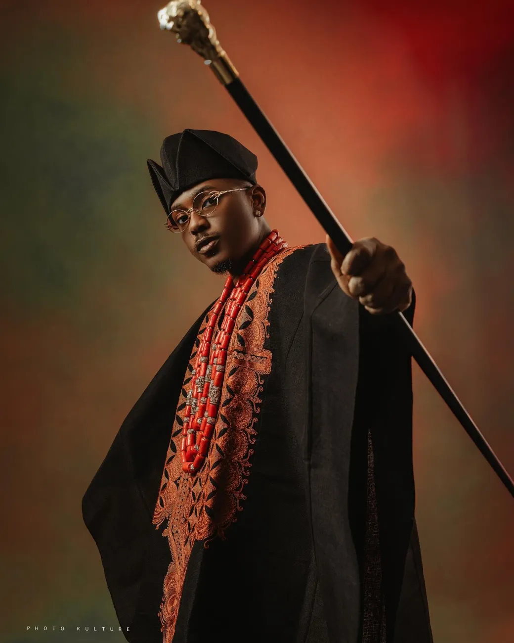 A Charcoal black, Arewa embroidery, front cut towards the back, traditional Agbada