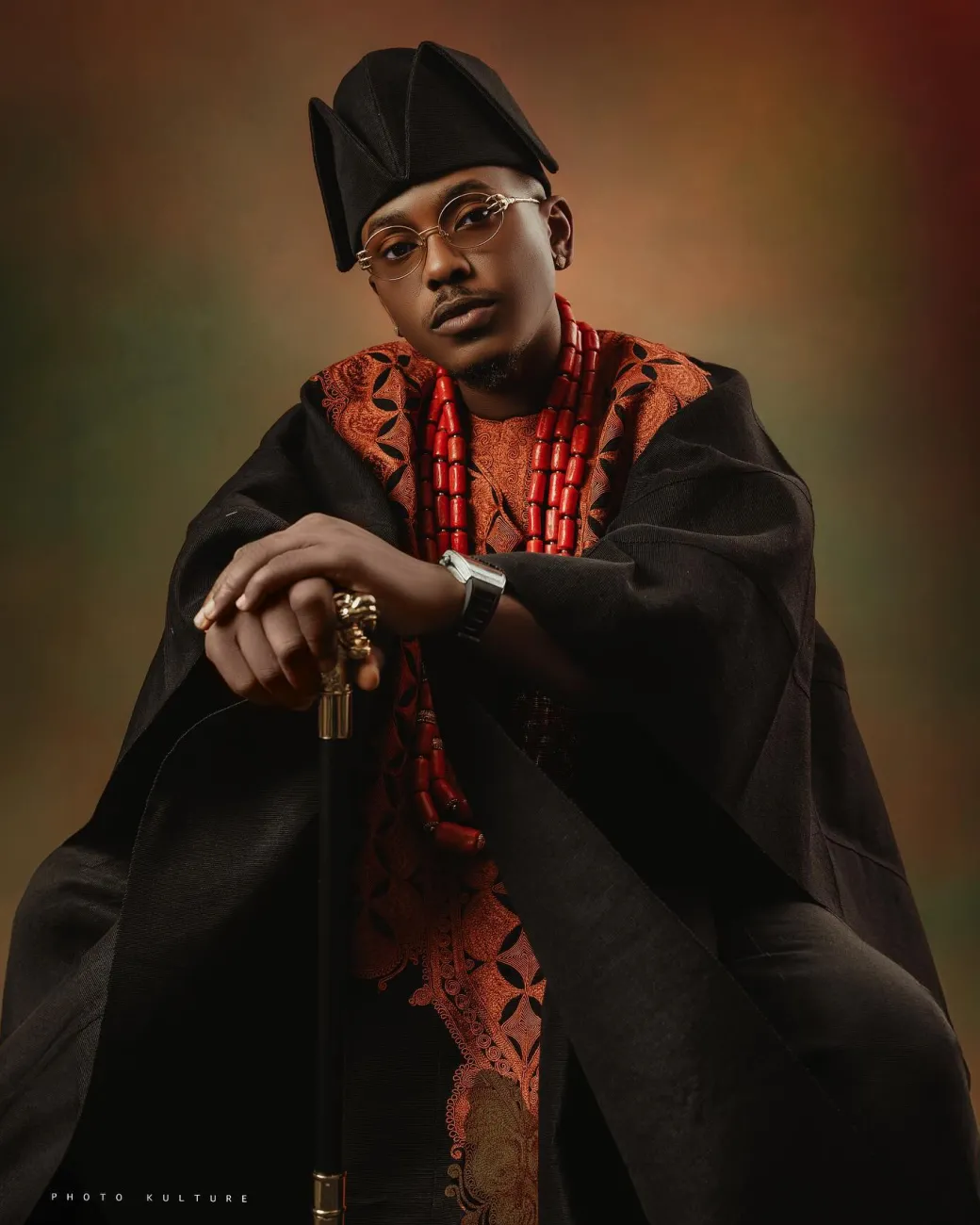 A Charcoal black, Arewa embroidery, front cut towards the back, traditional Agbada