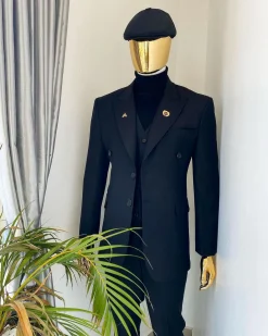 A charcoal black Bespoke reloaded “peaky blinders” peak lapel suit