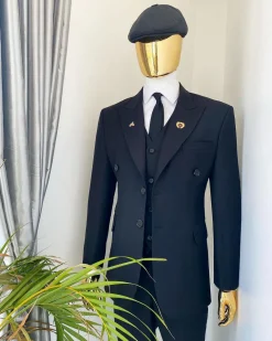 A charcoal black Bespoke reloaded “peaky blinders” peak lapel suit.