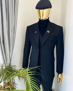 A charcoal black Bespoke reloaded “peaky blinders” peak lapel suit