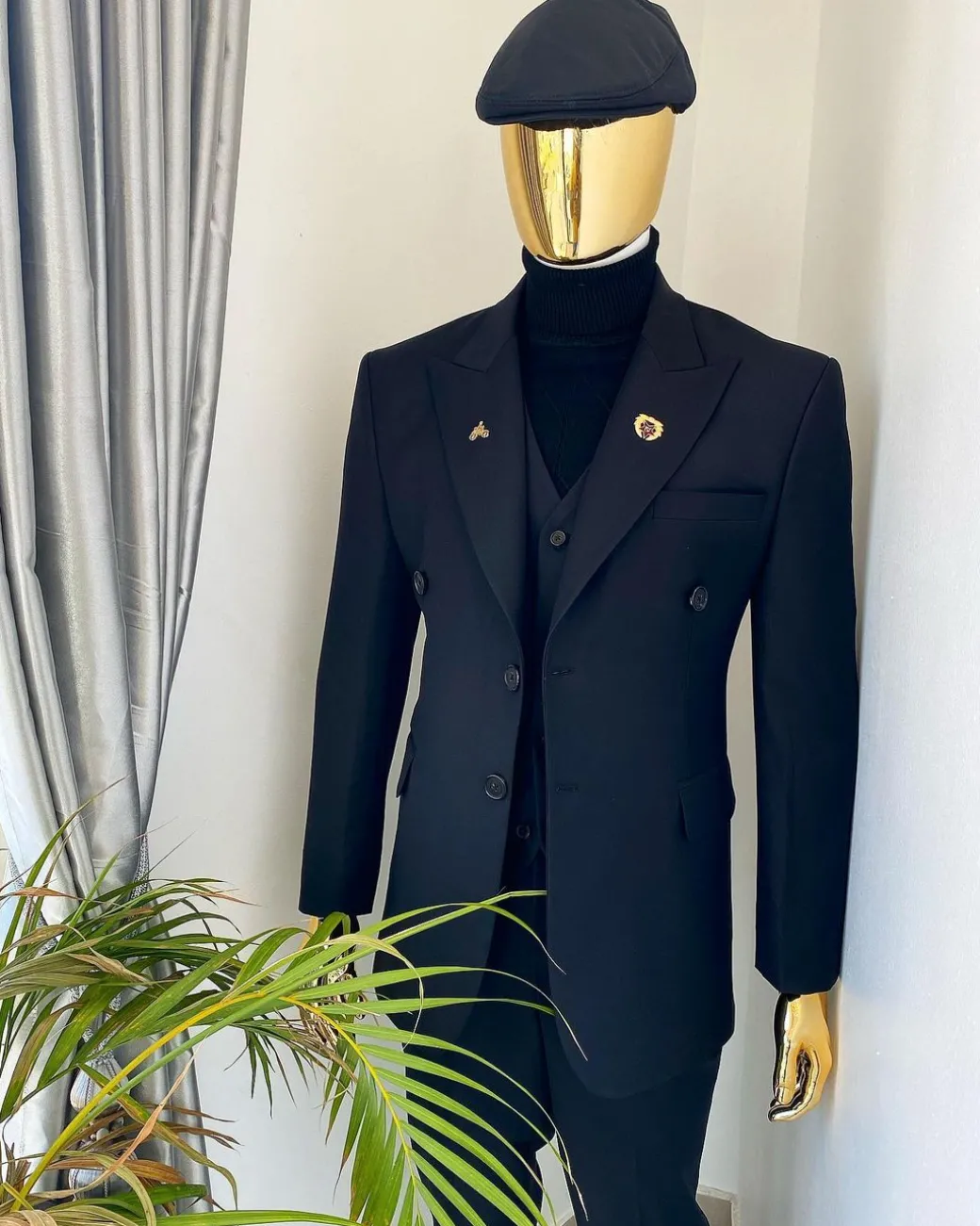 A charcoal black Bespoke reloaded “peaky blinders” peak lapel suit