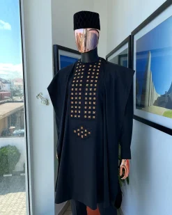 A charcoal black, connected square embroidery design with matching gold and red Swarovski stone details agbada