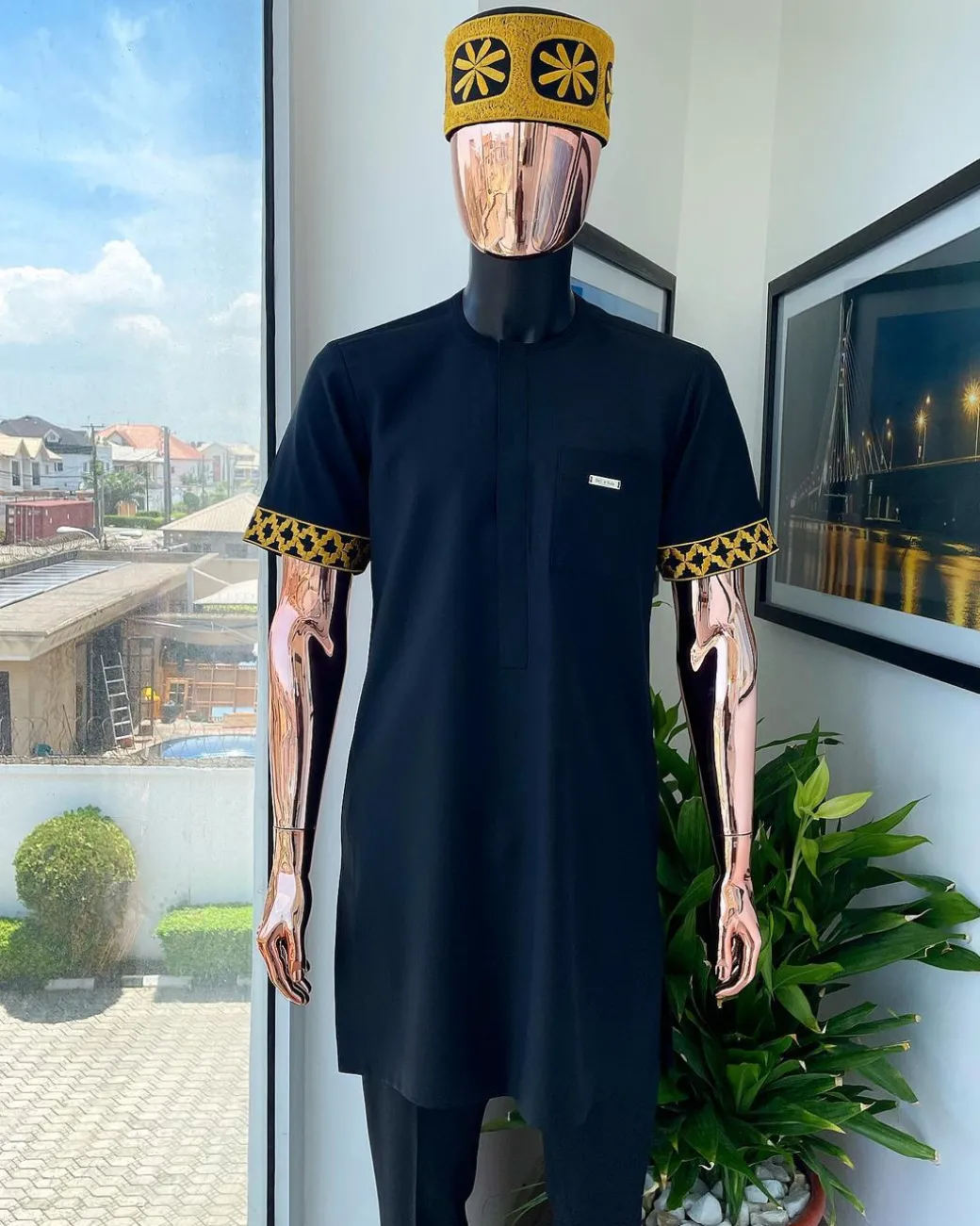 A Charcoal black, connected star gold embroidery detailing Senator Kaftan native.