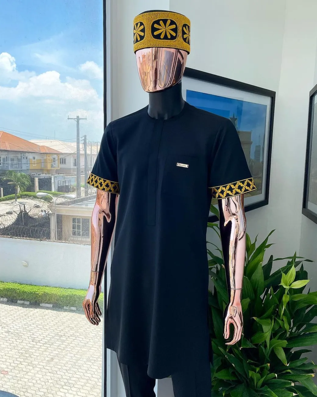 A Charcoal black, connected star gold embroidery detailing Senator Kaftan native.