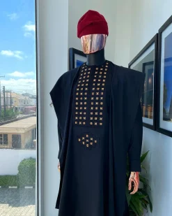 A charcoal black, connected square embroidery design with matching gold and red Swarovski stone details agbada