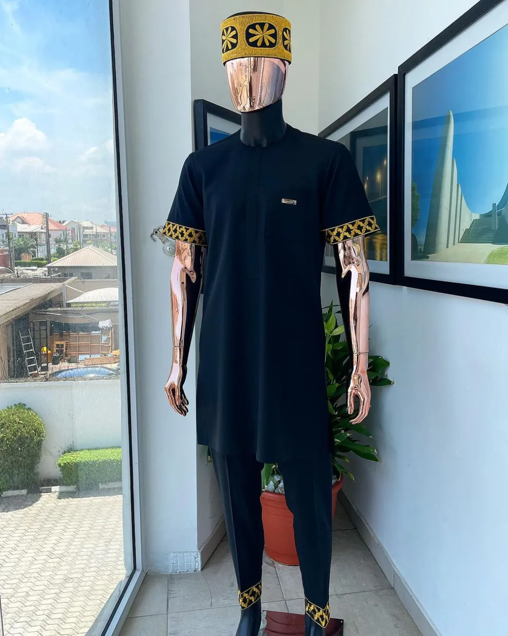 A Charcoal black, connected star gold embroidery detailing Senator Kaftan native.