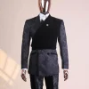 A charcoal black “equalizer” quadruple breasted, knitted, peak lapel with velvet tuxedo jacquard suit