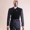 A charcoal black “equalizer” quadruple breasted, knitted, layered peak lapel with velvet overlay-ed tuxedo jacquard suit