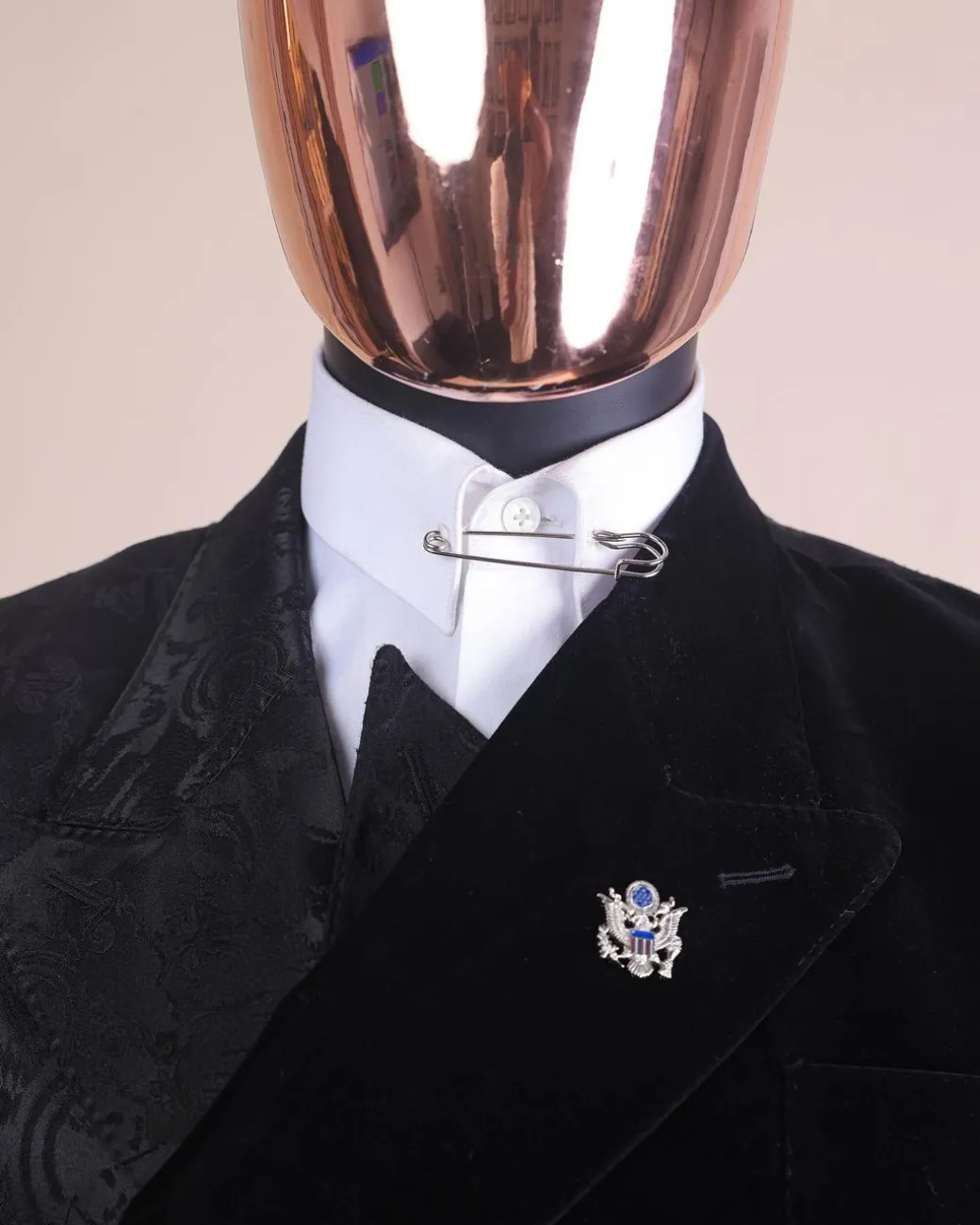 A charcoal black “equalizer” quadruple breasted, knitted, peak lapel with velvet tuxedo jacquard suit