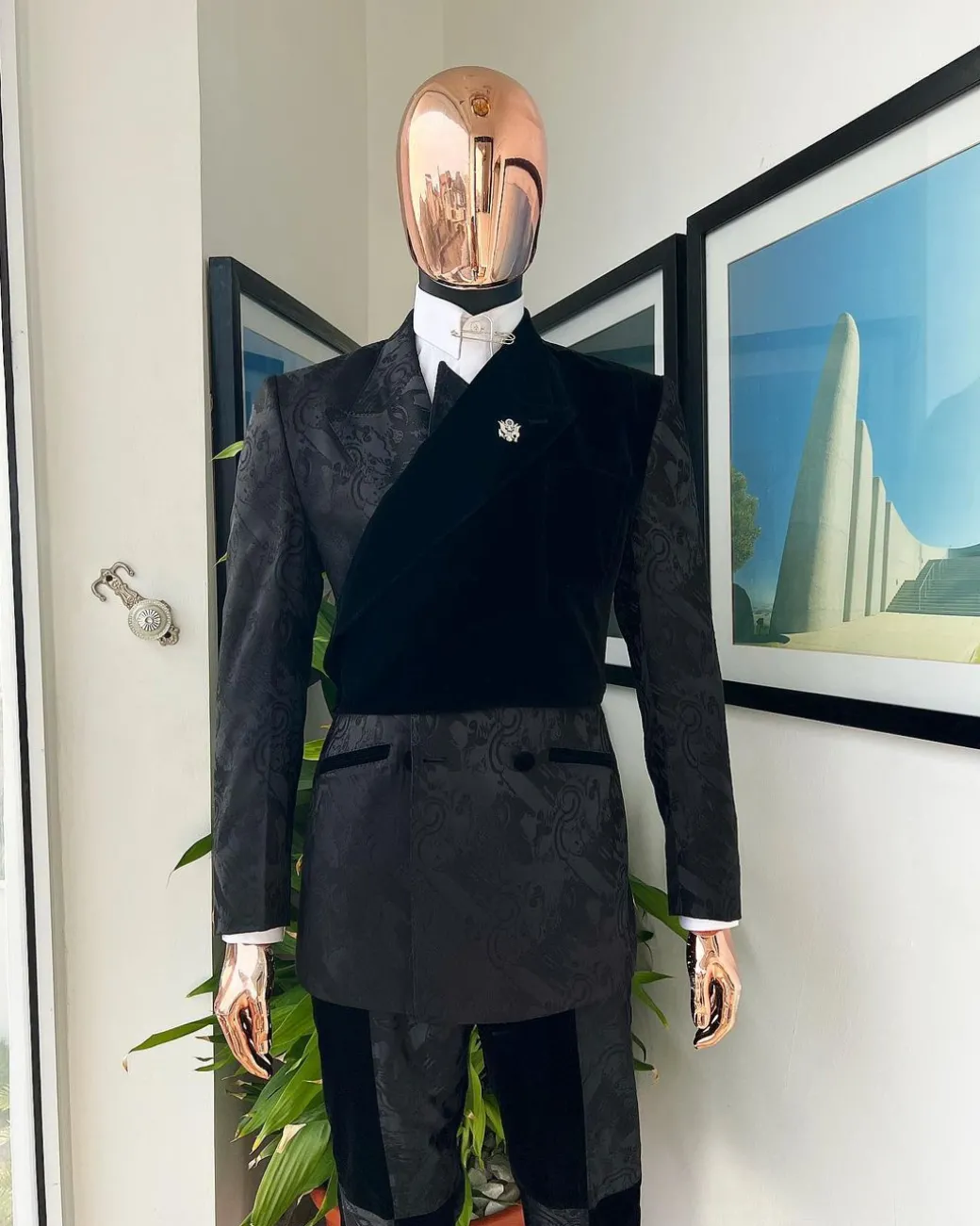 A charcoal black “equalizer” quadruple breasted, knitted, peak lapel with velvet tuxedo jacquard suit