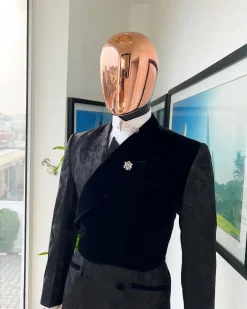 A charcoal black “equalizer” quadruple breasted, knitted, peak lapel with velvet tuxedo jacquard suit