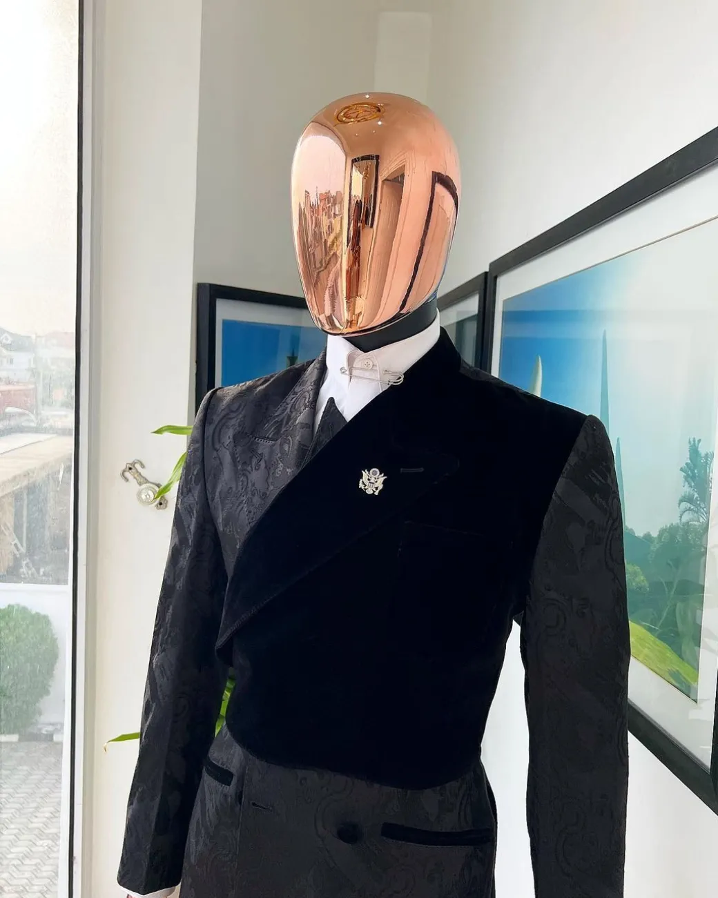A charcoal black “equalizer” quadruple breasted, knitted, peak lapel with velvet tuxedo jacquard suit