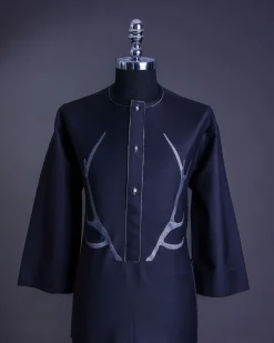 A charcoal black front flap, deer horn embroidery, clear view Swarovski buttons, 3/4 sleeve details, African senator Kaftan native.