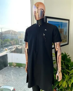 A Charcoal black, front flap, roaring tiger patch design and Swarovski button details african traditional senator kaftan native.