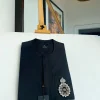 A charcoal black front flap and hand embroidery patch detail traditional African kaftan