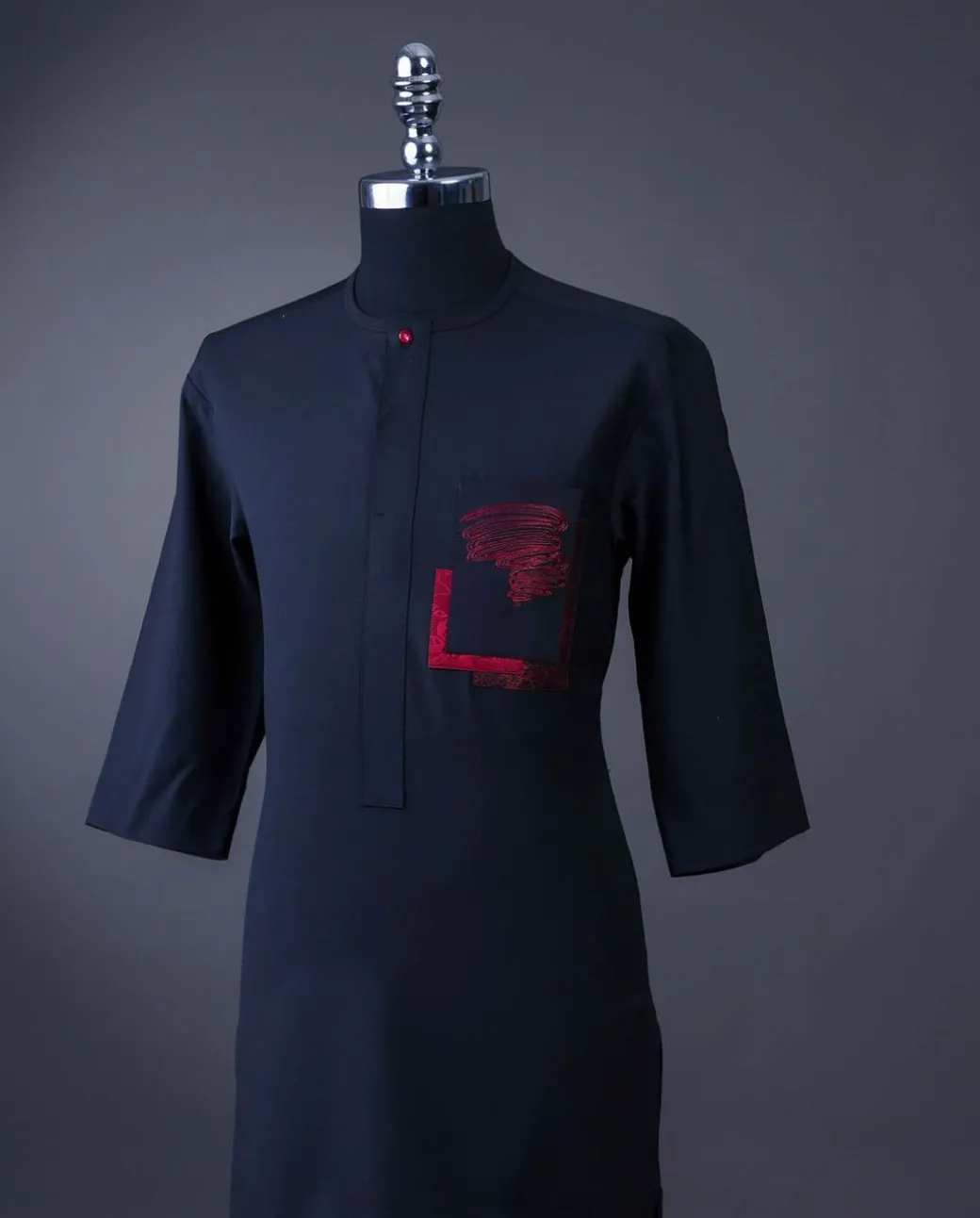 A charcoal black front flap with crystal Swarovski buttons, flame embroidery 3/4 sleeve details African senator kaftan native.