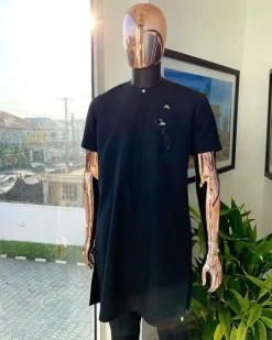 A Charcoal black, front flap, roaring tiger patch design and Swarovski button details african traditional senator kaftan native.