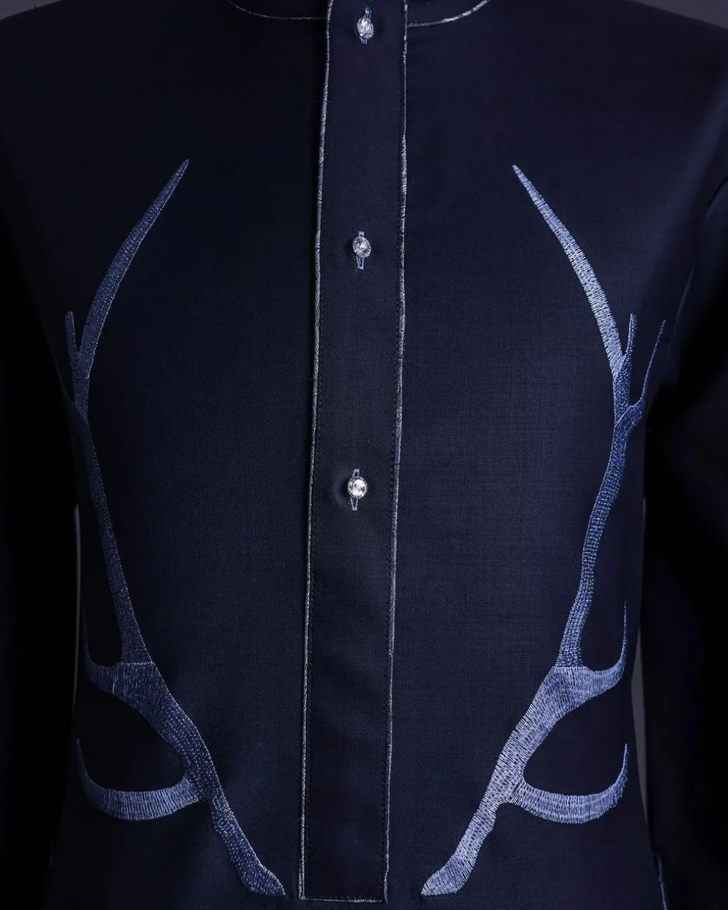A charcoal black front flap, deer horn embroidery, clear view Swarovski buttons, 3/4 sleeve details, African senator Kaftan native.