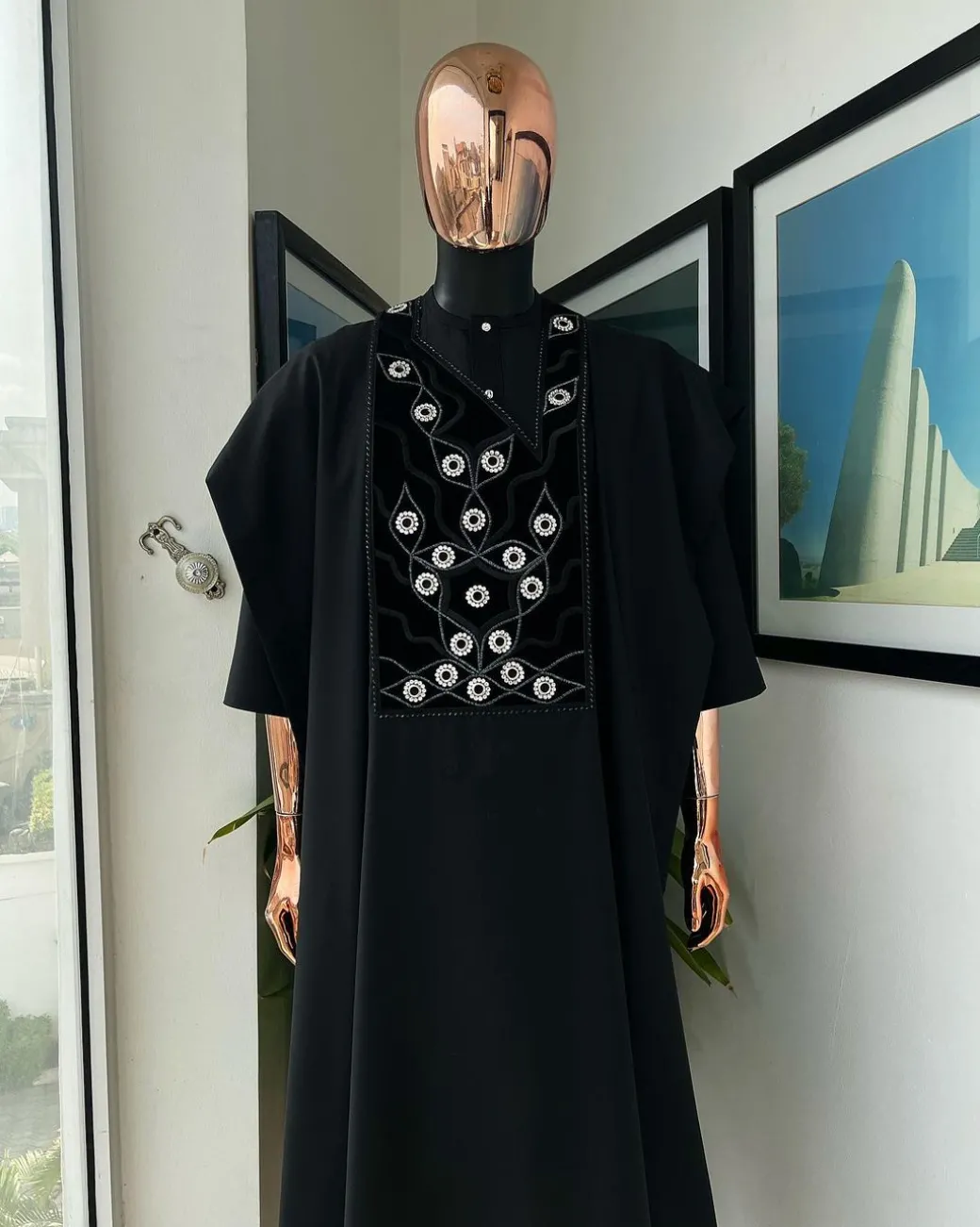 A charcoal black, grommet eyelet on root splash embroidery details agbada