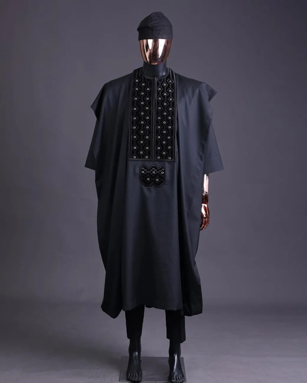 A charcoal black, grommet eyelet on dropping octa embroidery details agbada