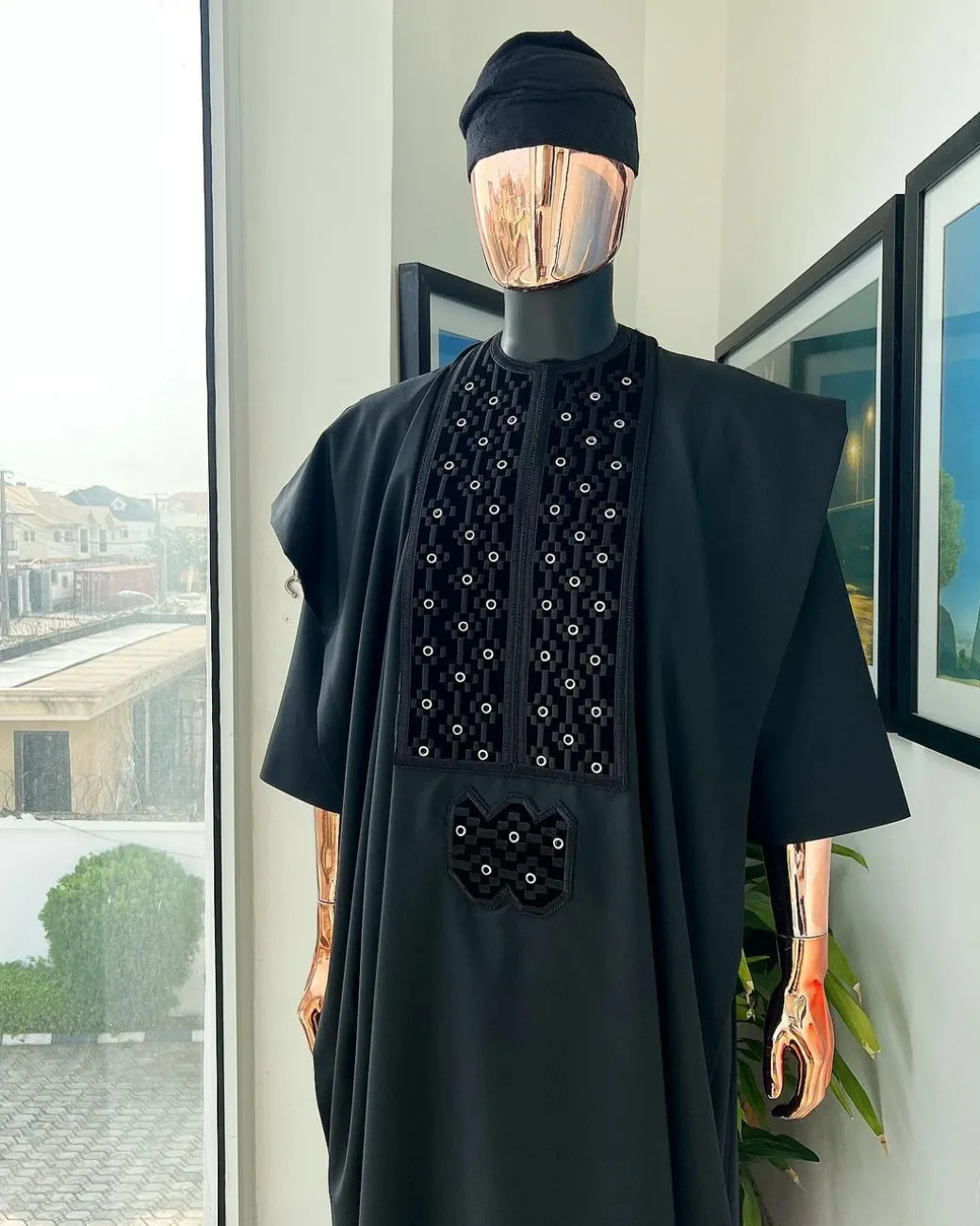 A charcoal black, grommet eyelet on dropping octa embroidery details agbada