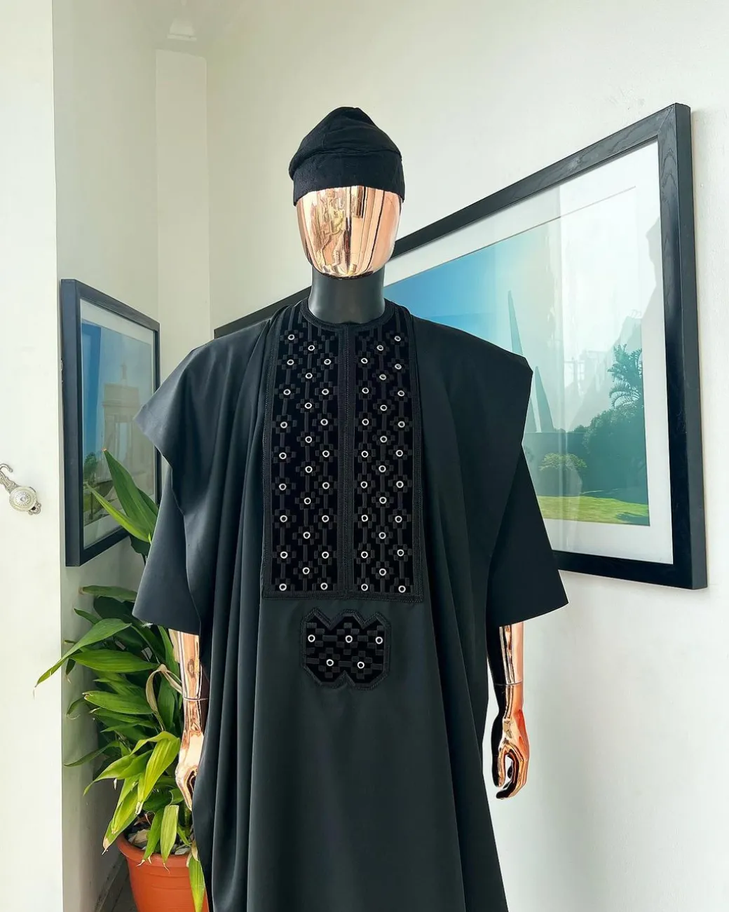 A charcoal black, grommet eyelet on dropping octa embroidery details agbada