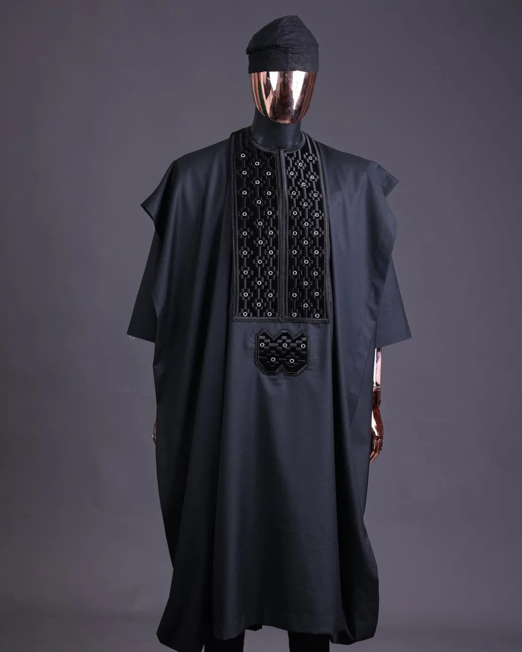 A charcoal black, grommet eyelet on dropping octa embroidery details agbada
