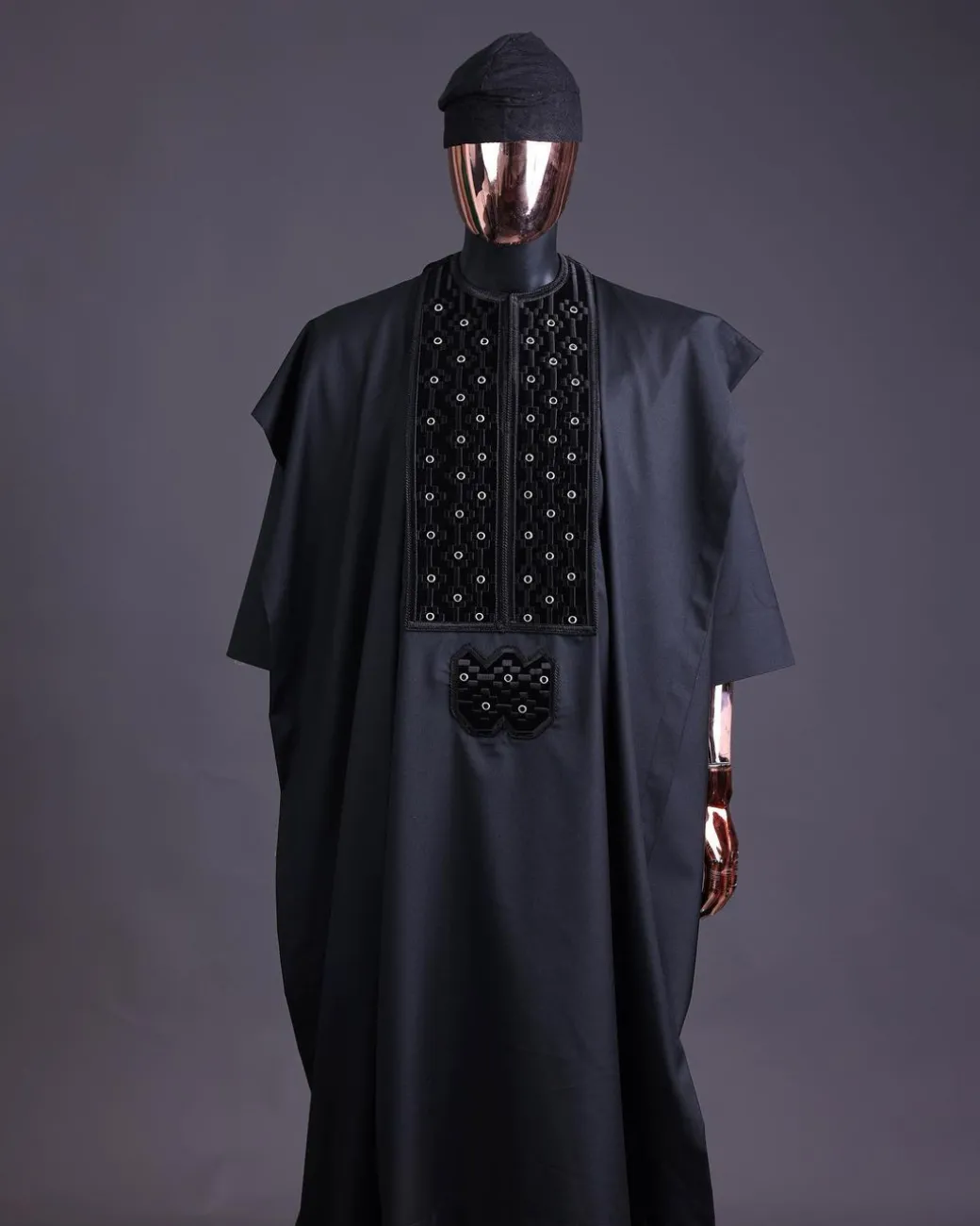 A charcoal black, grommet eyelet on dropping octa embroidery details agbada