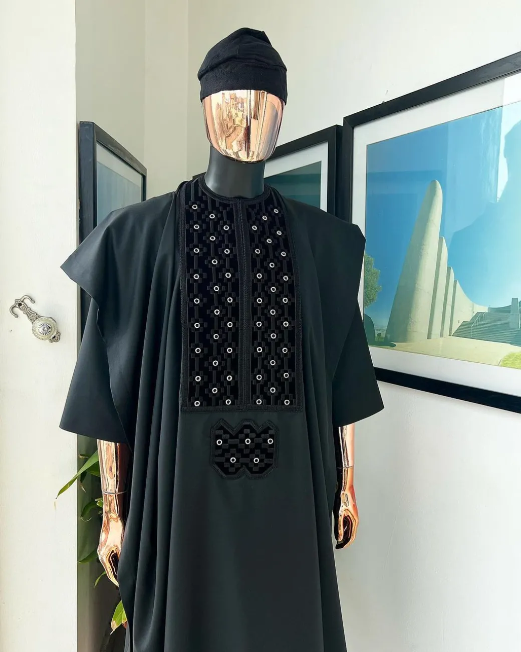 A charcoal black, grommet eyelet on dropping octa embroidery details agbada