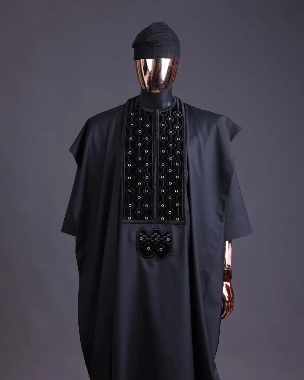 A charcoal black, grommet eyelet on dropping octa embroidery details agbada