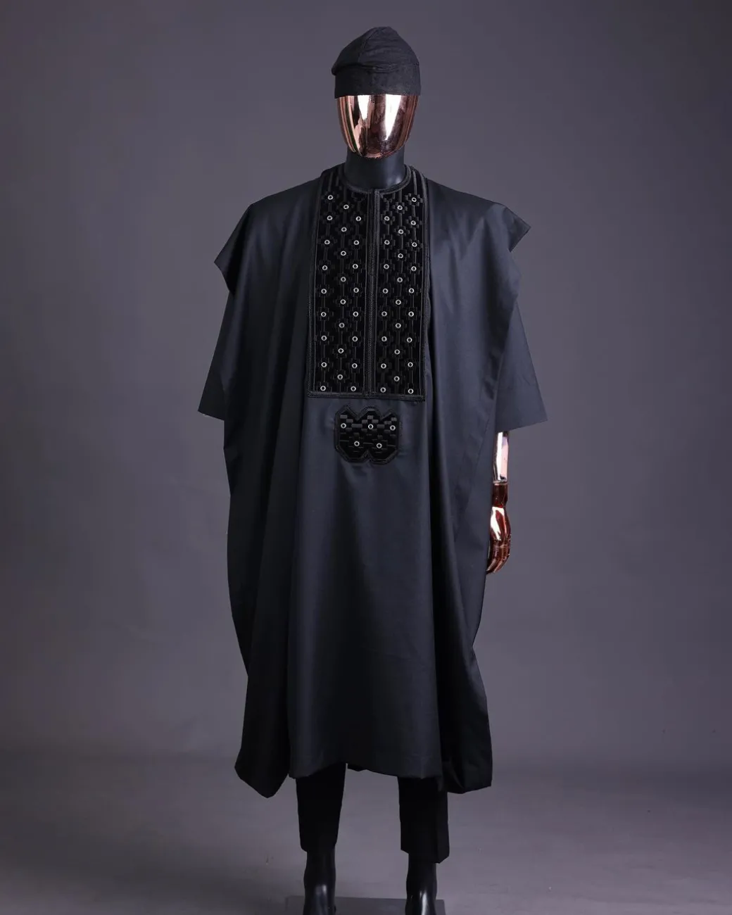 A charcoal black, grommet eyelet on dropping octa embroidery details agbada