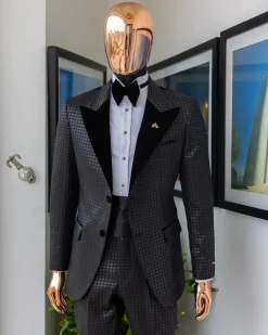 A Charcoal black inverted square patterned metallic jacquard tuxedo with charcoal black velvet peak lapel suit