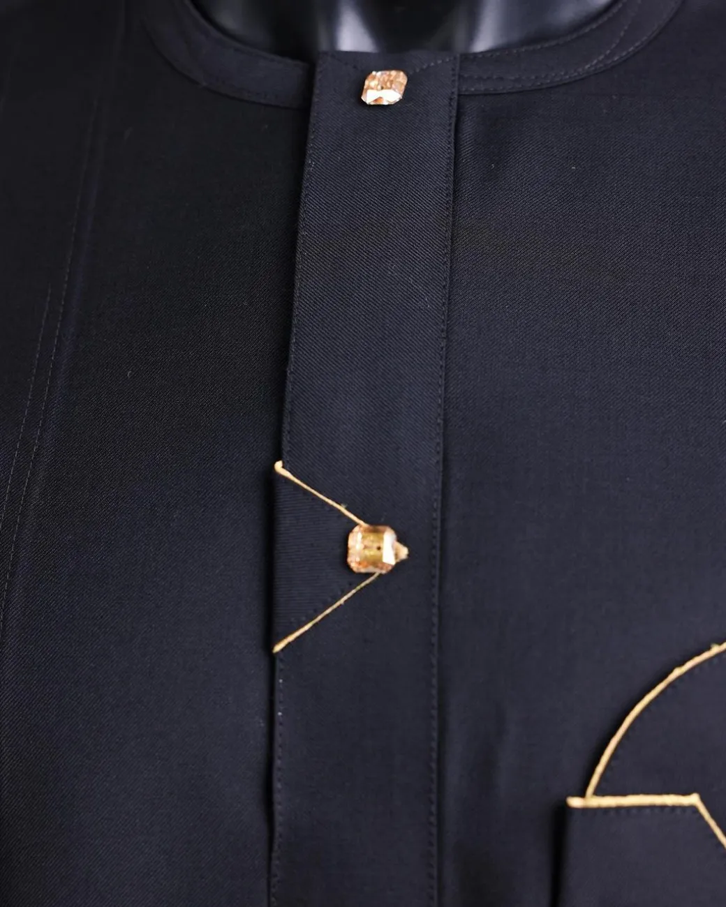 A charcoal black, inverted and closed flap shaped pocket details, 3/4 sleeve African senator kaftan native.