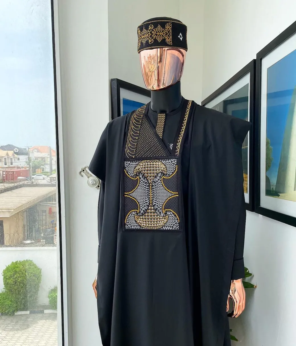 A Charcoal black, kissing wavelength embroidery design with ss30 light topaz and crystal xilion Swarovski stones detailing agbada