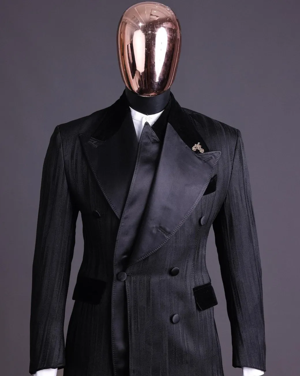 A Charcoal Black “Mandate” rain drop patterned jacquard, triple breasted, dropping sache tuxedo suit