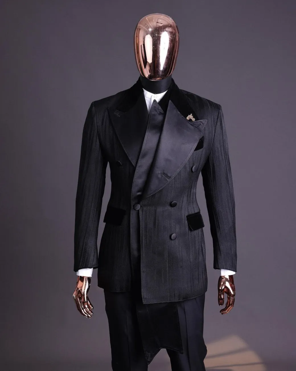 A Charcoal Black “Mandate” rain drop patterned jacquard, triple breasted, dropping sache tuxedo suit