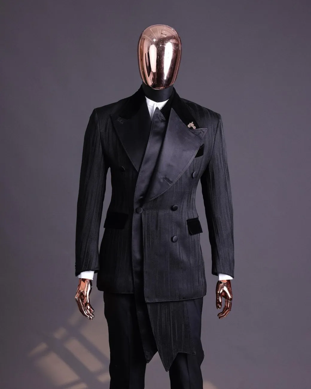 A Charcoal Black “Mandate” rain drop patterned jacquard, triple breasted, 2 layer dropping sache tuxedo suit.