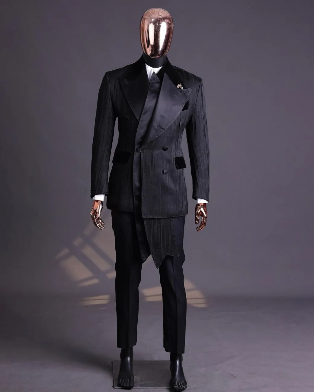 A Charcoal Black “Mandate” rain drop patterned jacquard, triple breasted, 2 layer dropping sache tuxedo suit.