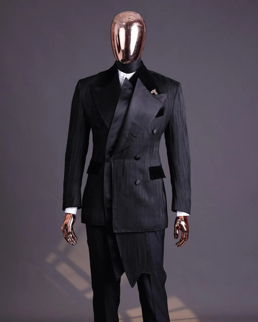A Charcoal Black “Mandate” rain drop patterned jacquard, triple breasted, 2 layer dropping sache tuxedo suit.