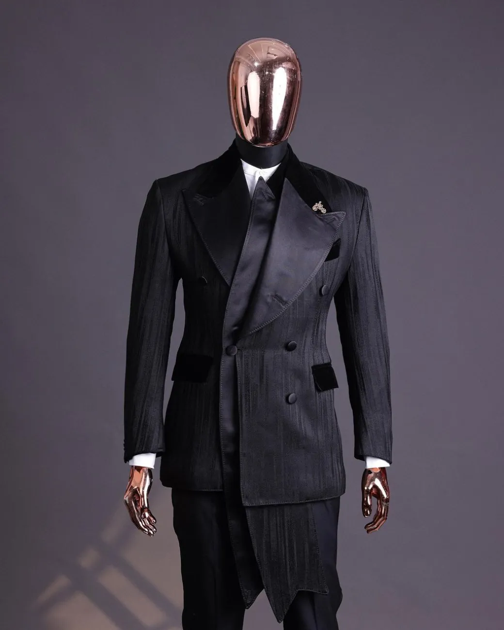 A Charcoal Black “Mandate” rain drop patterned jacquard, triple breasted, 2 layer dropping sache tuxedo suit.