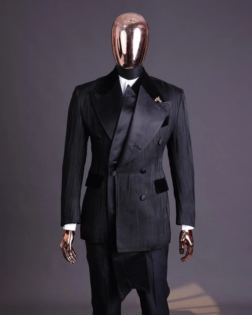 A Charcoal Black “Mandate” rain drop patterned jacquard, triple breasted, dropping sache tuxedo suit
