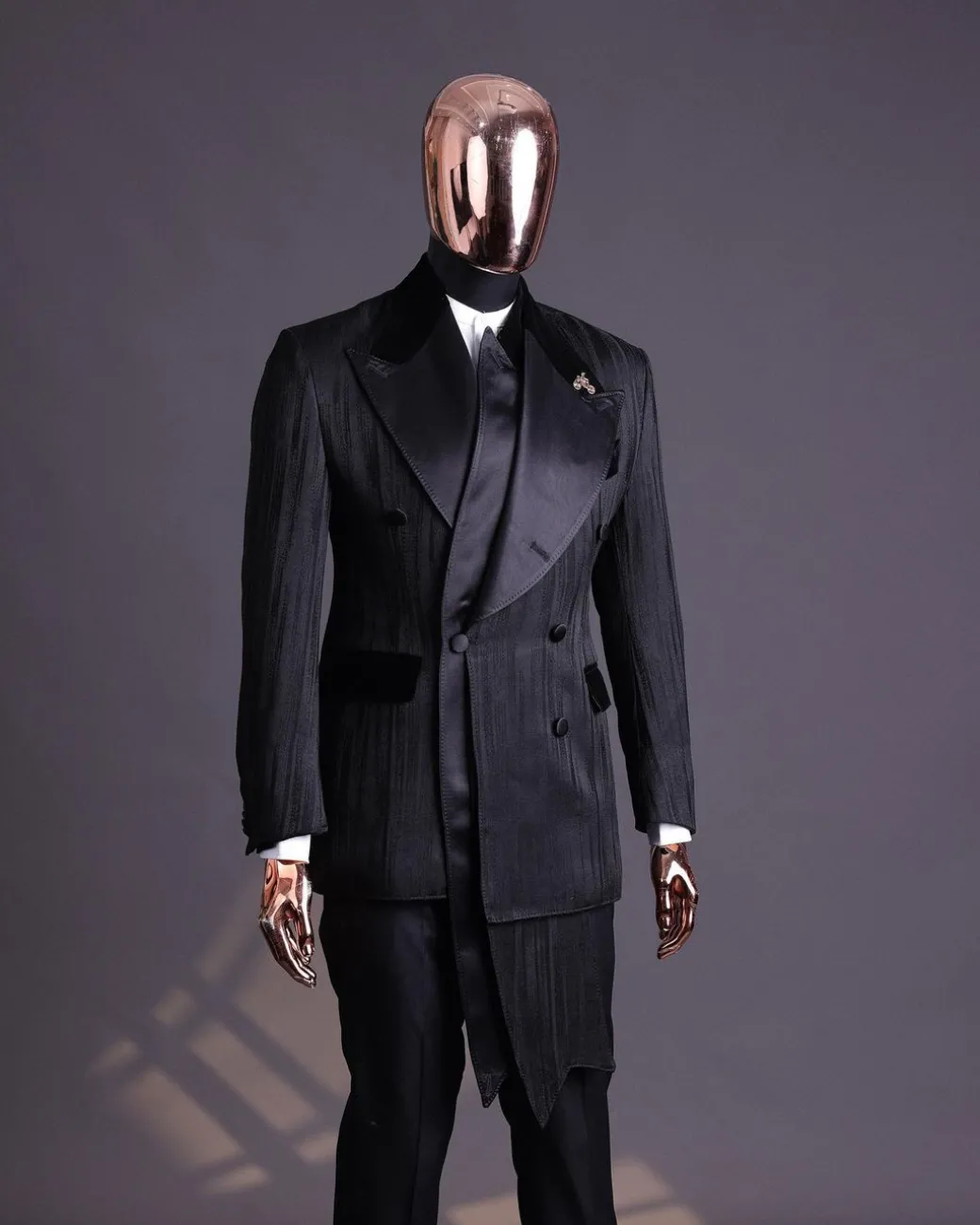 A Charcoal Black “Mandate” rain drop patterned jacquard, triple breasted, 2 layer dropping sache tuxedo suit.