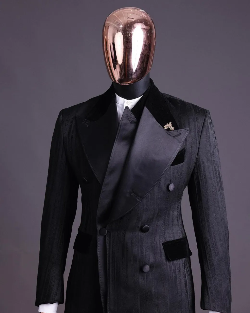 A Charcoal Black “Mandate” rain drop patterned jacquard, triple breasted, dropping sache tuxedo suit