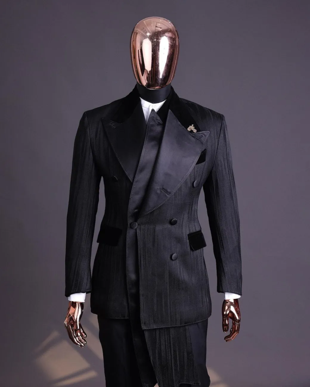 A Charcoal Black “Mandate” rain drop patterned jacquard, triple breasted, 2 layer dropping sache tuxedo suit.