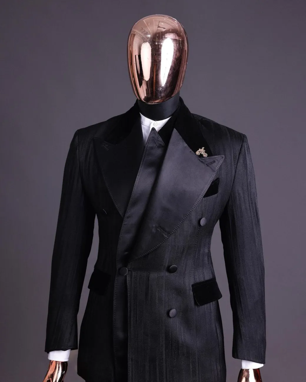 A Charcoal Black “Mandate” rain drop patterned jacquard, triple breasted, 2 layer dropping sache tuxedo suit.