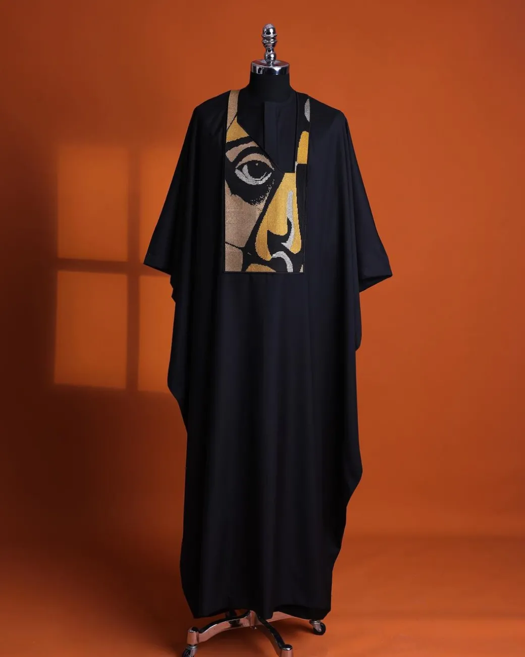 A Charcoal black, “Oju Aye” on canvas gold and black mix embroidery details Agbada
